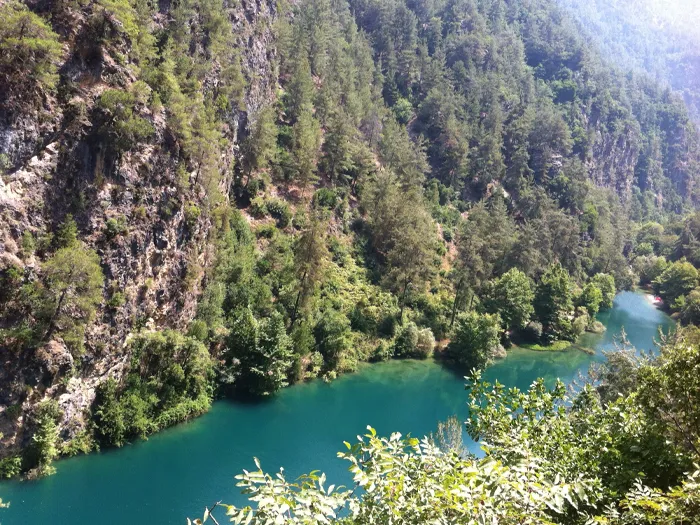 The Nahr Ibrahim river valley surrounded by rocky slopes and trees